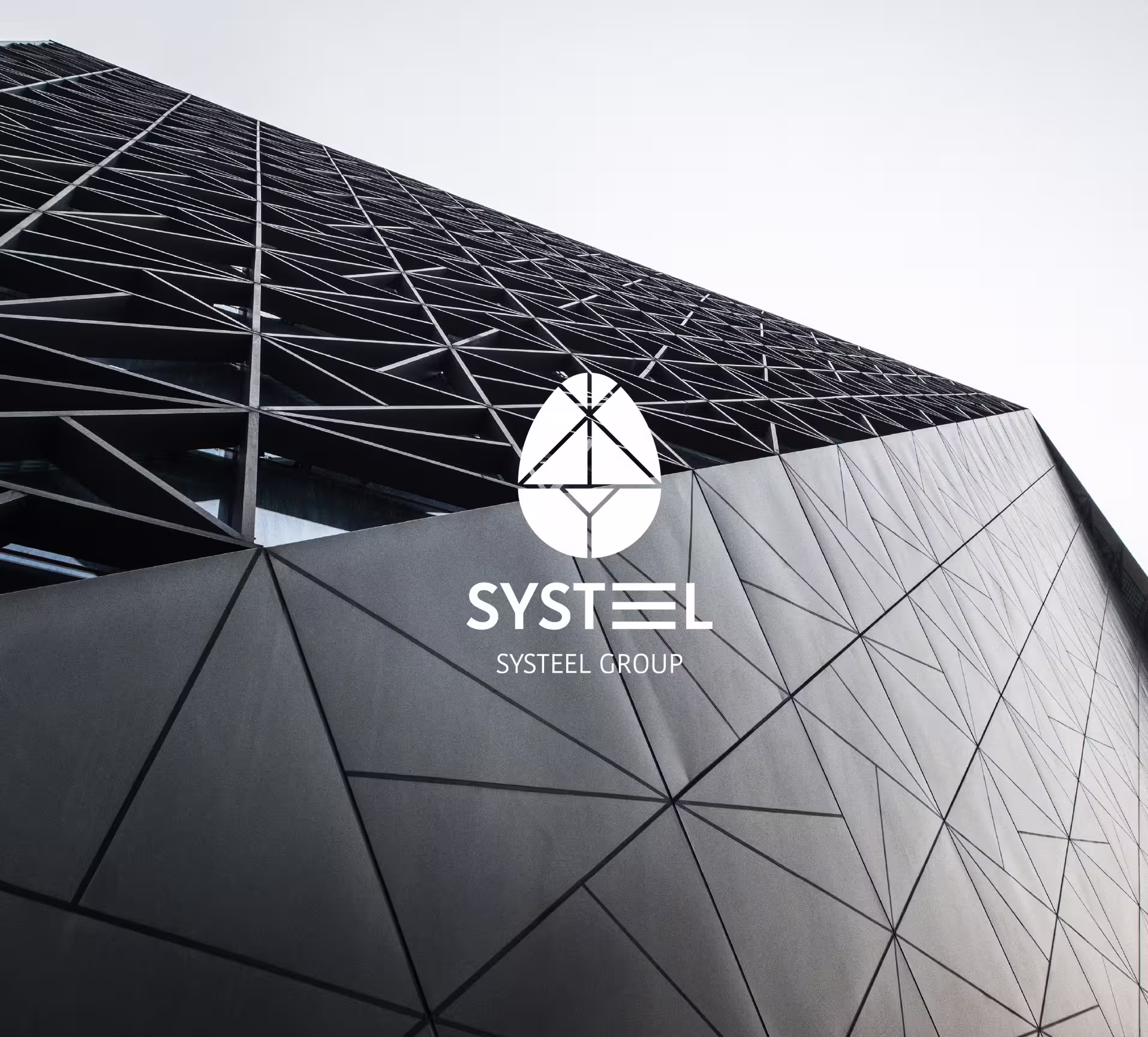 Systeel Group logo in white over a building with a triangular steel facade